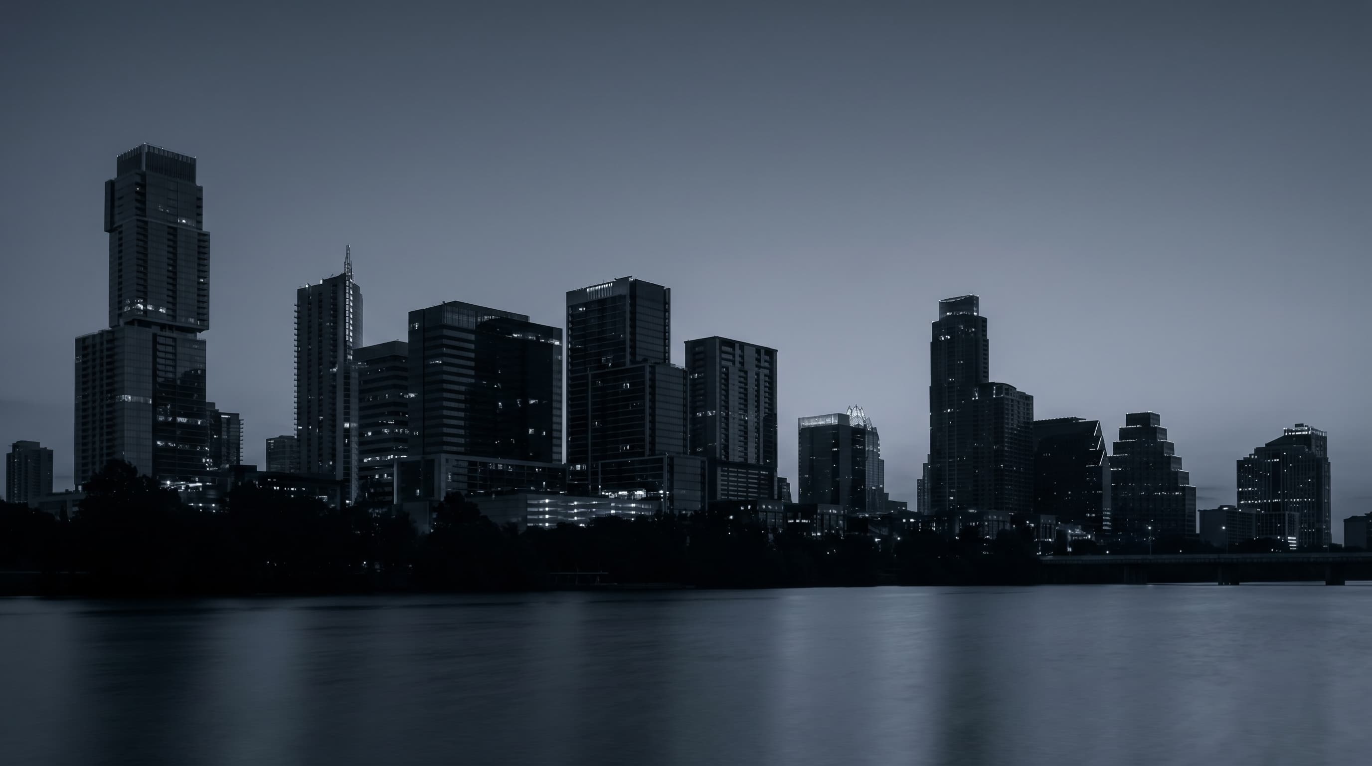 Austin, Texas at night, the modern downtown skyline reflected on Lady Bird Lake